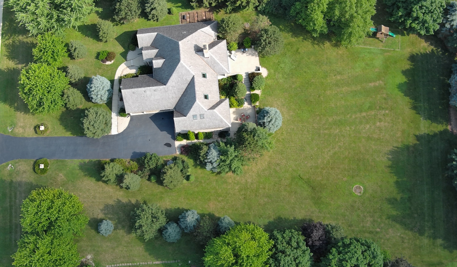 8407 Appaloosa Lane Spring Grove, IL 60081 - Photo 3 of 6 an aerial view of residential house with outdoor space and trees all around