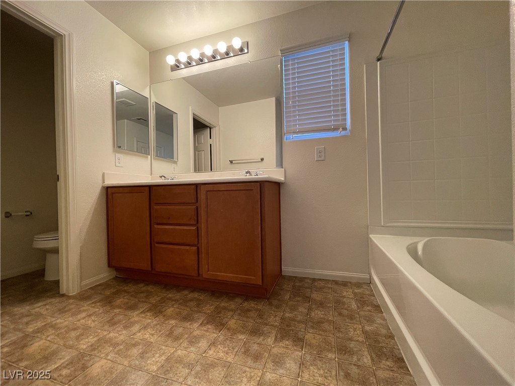 10632 Summerbell Street Las Vegas, NV 89179 - Photo 13 of 16 Full bath featuring double vanity and shower / washtub combination