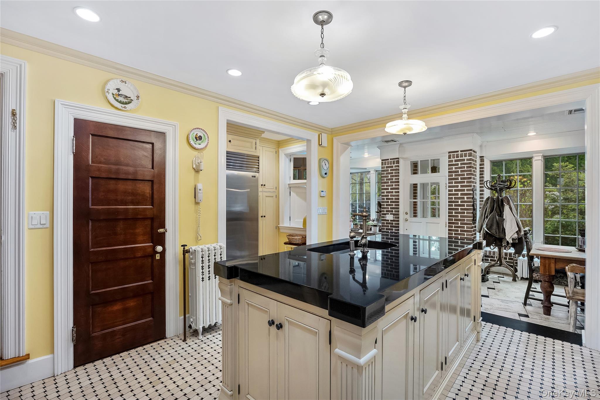 1-27 Beverly Road Queens, NY 11363 - Photo 32 of 46 a kitchen with granite countertop a sink and refrigerator