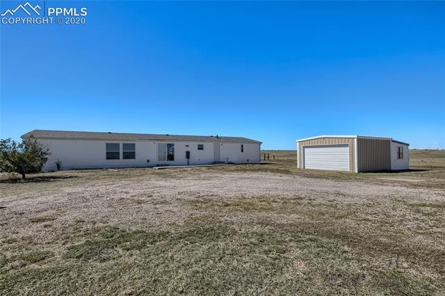 8650 Mulberry Road Calhan, CO 80808 - Photo 15 of 17 Rear of Home and Two Car Detached Garage/Shed facing East
