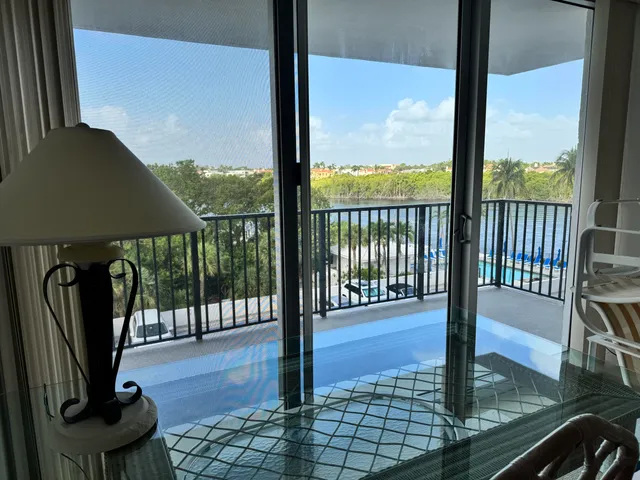 a view of a floor to ceiling window with wooden floor