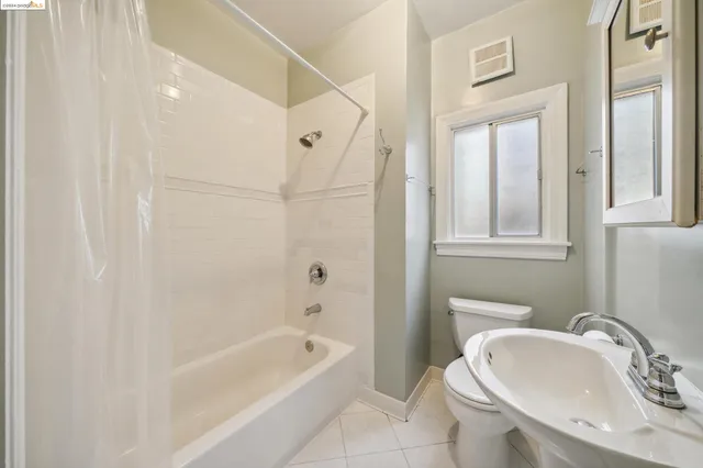 a bathroom with a sink a toilet and a bathtub