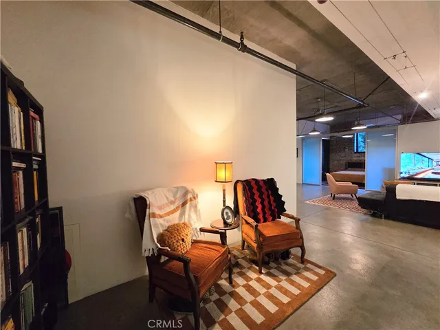 a outdoor space with lots of chairs and a projector