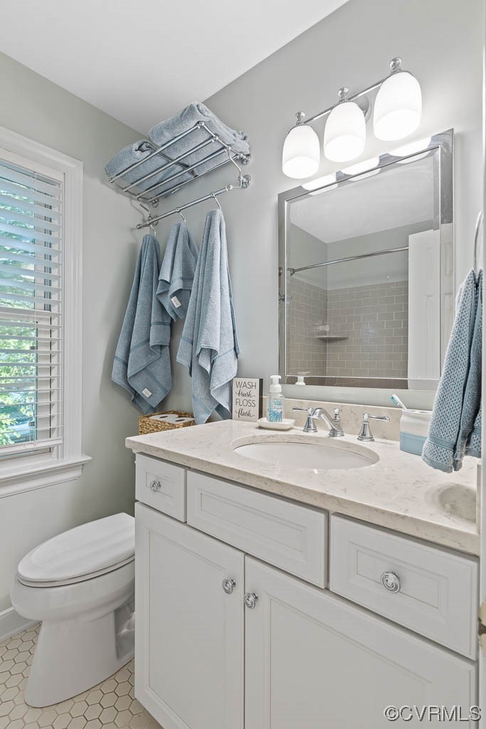 14704 Acorn Ridge Place Midlothian, VA 23112 - Photo 15 of 17 a bathroom with a toilet sink and mirror