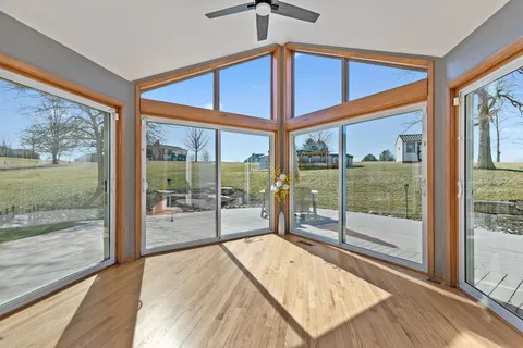 a room with window and pool table