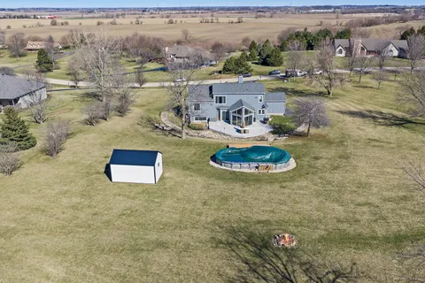an aerial view of residential house with outdoor space