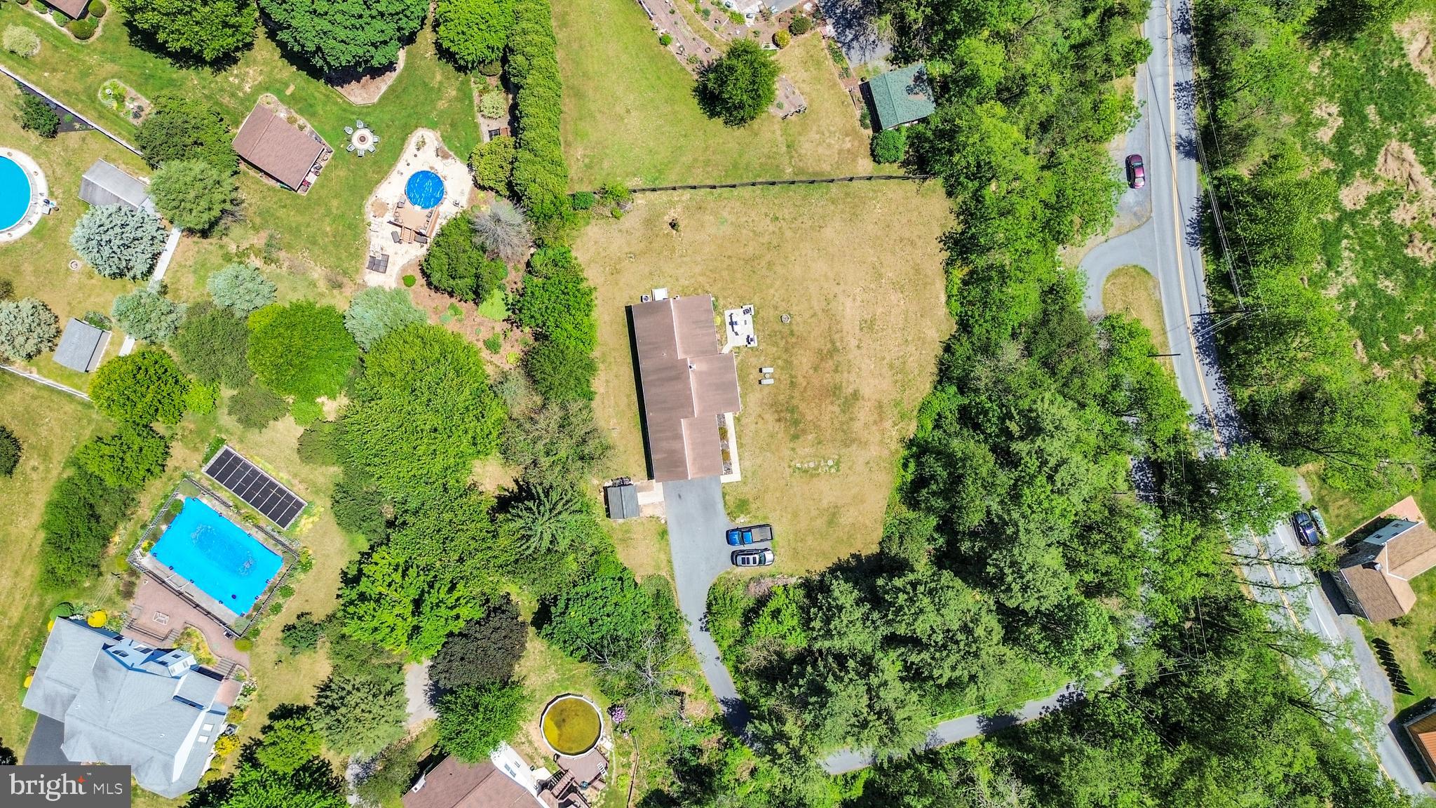 97 Bertolet Mill Road Oley, PA 19547 - Photo 33 of 35 an aerial view of a house with a yard and garden