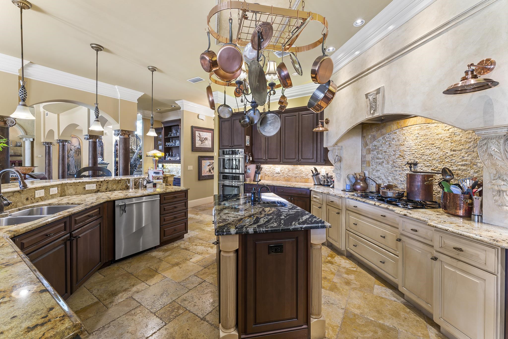8289 Colee Cove Road St. Augustine, FL 32092 - Photo 14 of 50 a kitchen with stainless steel appliances granite countertop a sink a stove and a wooden floors