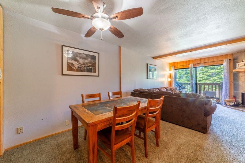 3253 Meridian Boulevard, Unit 214 Mammoth Lakes, CA 93546 - Photo 14 of 28 a dining room with furniture and window