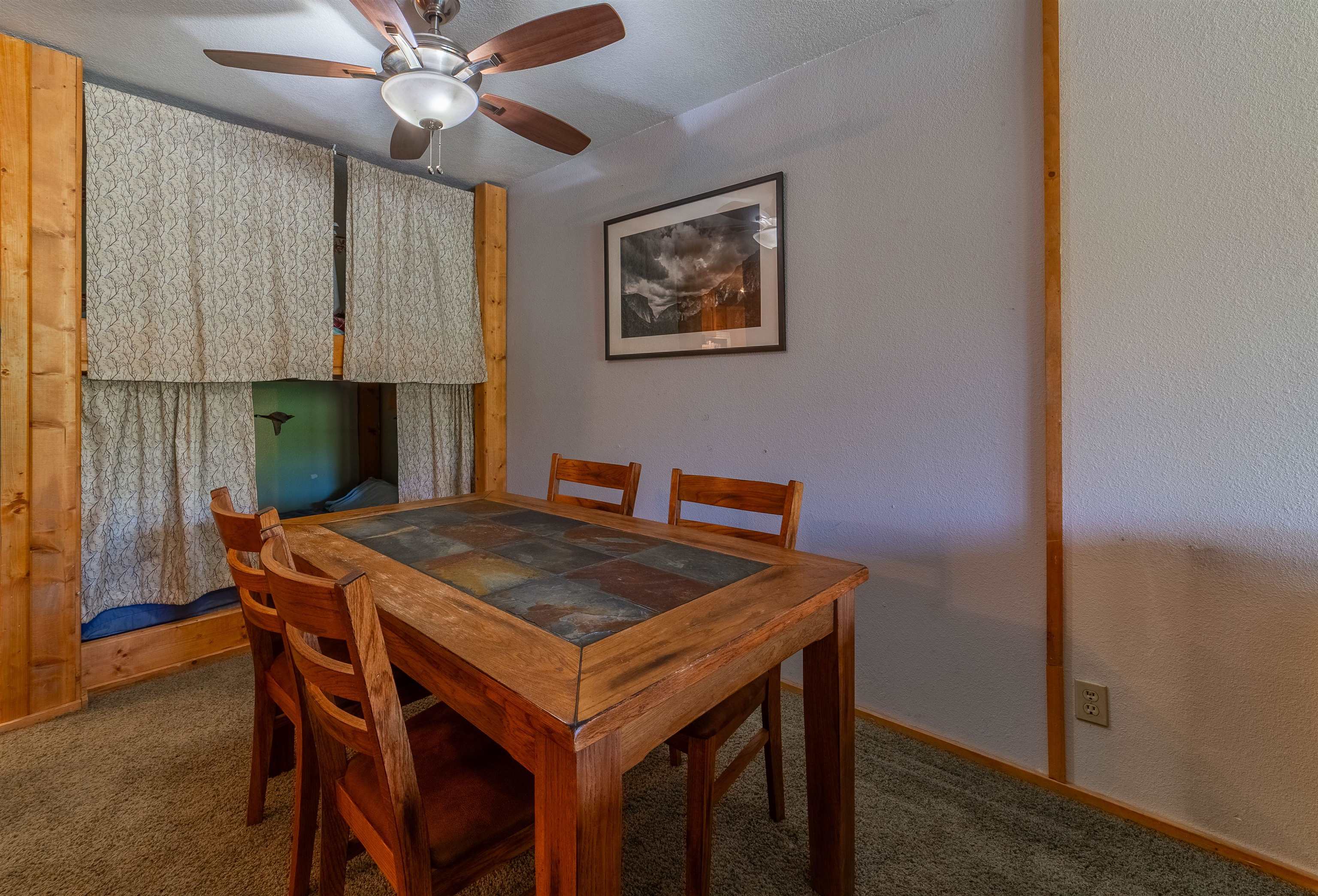 3253 Meridian Boulevard, Unit 214 Mammoth Lakes, CA 93546 - Photo 15 of 28 a dining room with a table and chairs