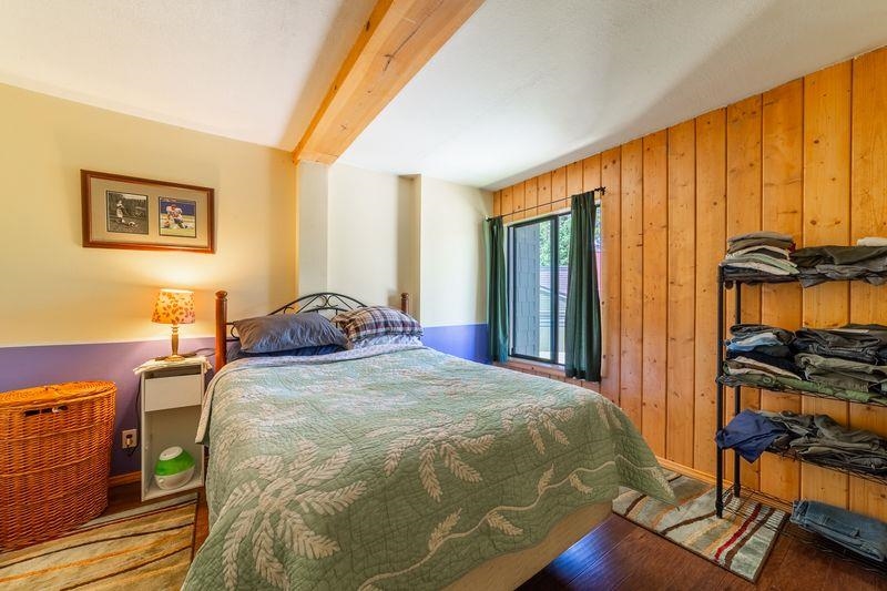 3253 Meridian Boulevard, Unit 214 Mammoth Lakes, CA 93546 - Photo 18 of 28 a bed sitting in a bedroom next to a window