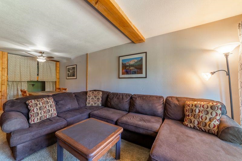 3253 Meridian Boulevard, Unit 214 Mammoth Lakes, CA 93546 - Photo 6 of 28 a living room with a couch and a couch