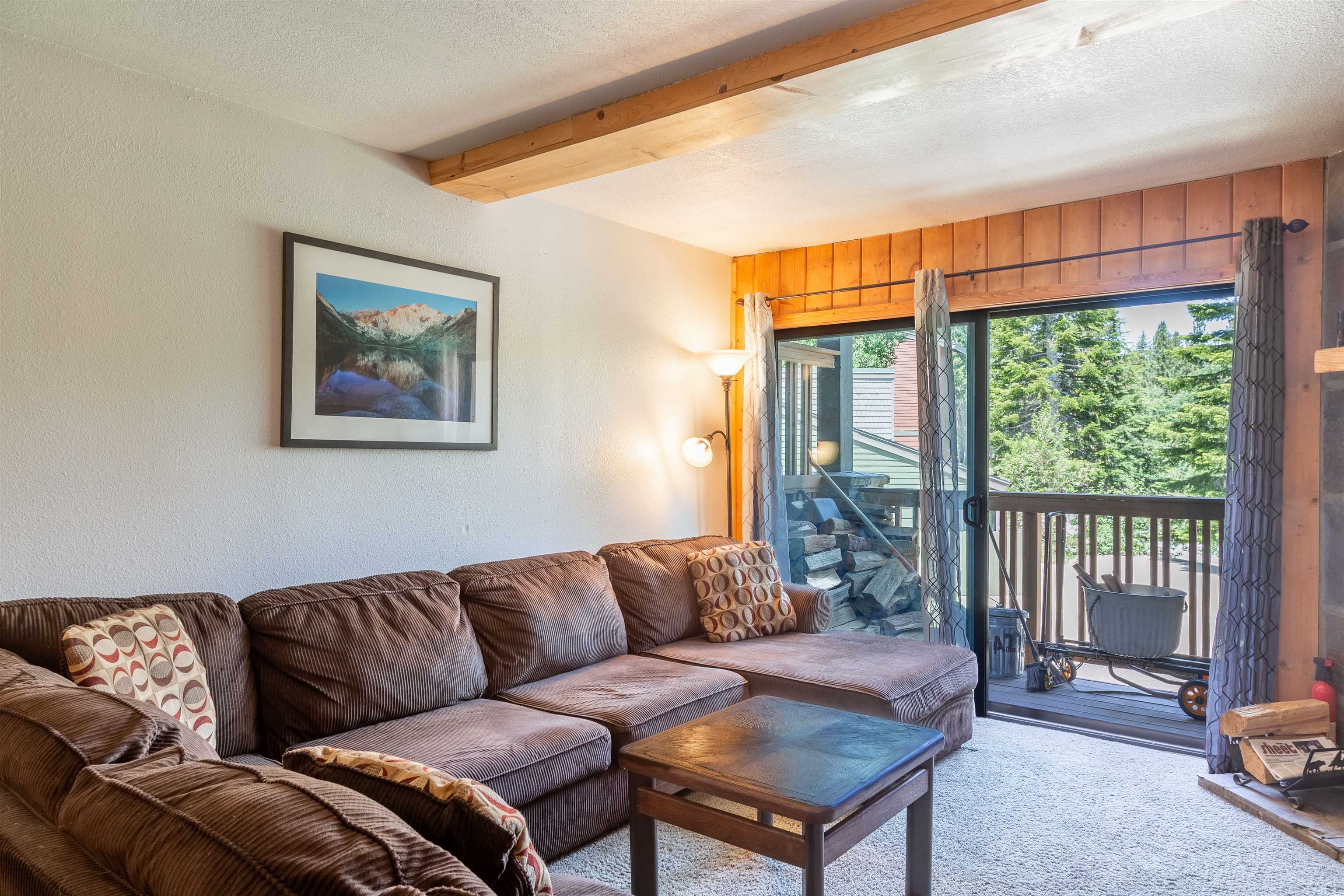 3253 Meridian Boulevard, Unit 214 Mammoth Lakes, CA 93546 - Photo 8 of 28 a living room with furniture and a window