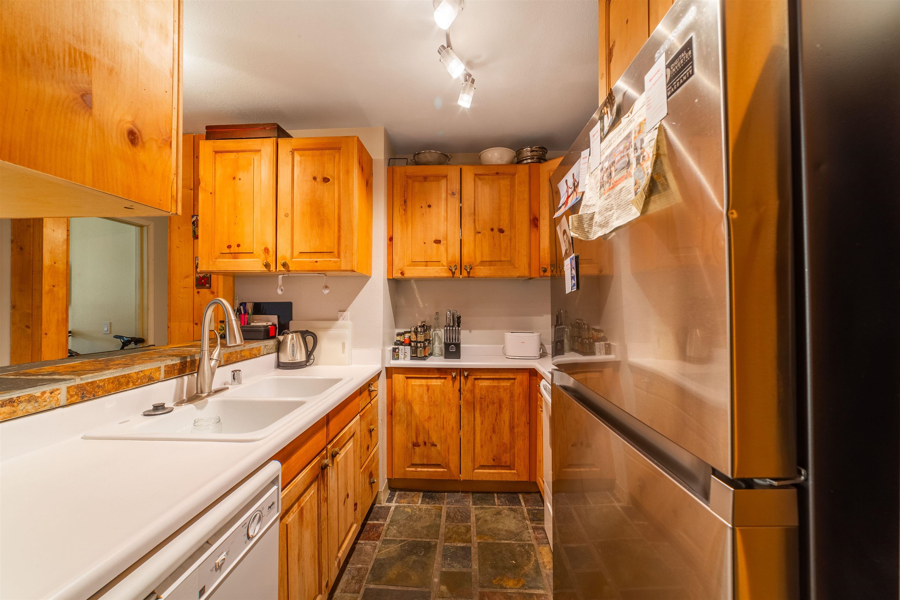 3253 Meridian Boulevard, Unit 214 Mammoth Lakes, CA 93546 - Photo 10 of 28 a bathroom with a sink large mirror and a bathtub