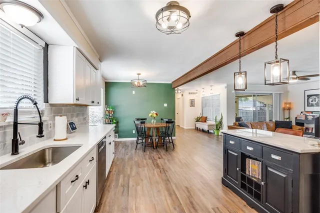 a tree in front of a white house