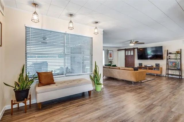 a living room with furniture and flat screen tv
