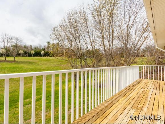 104 Hampton Road Leicester, NC 28748 - Photo 7 of 19 a view of a wooden deck with a yard