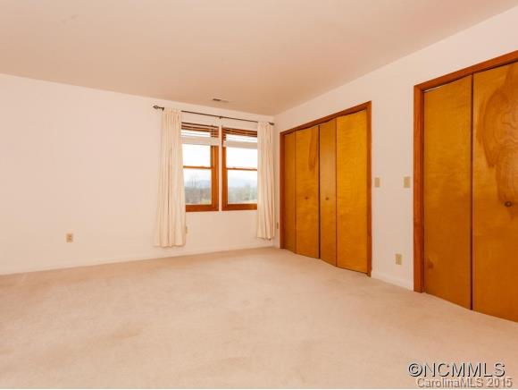 104 Hampton Road Leicester, NC 28748 - Photo 9 of 19 a view of an empty room with a window