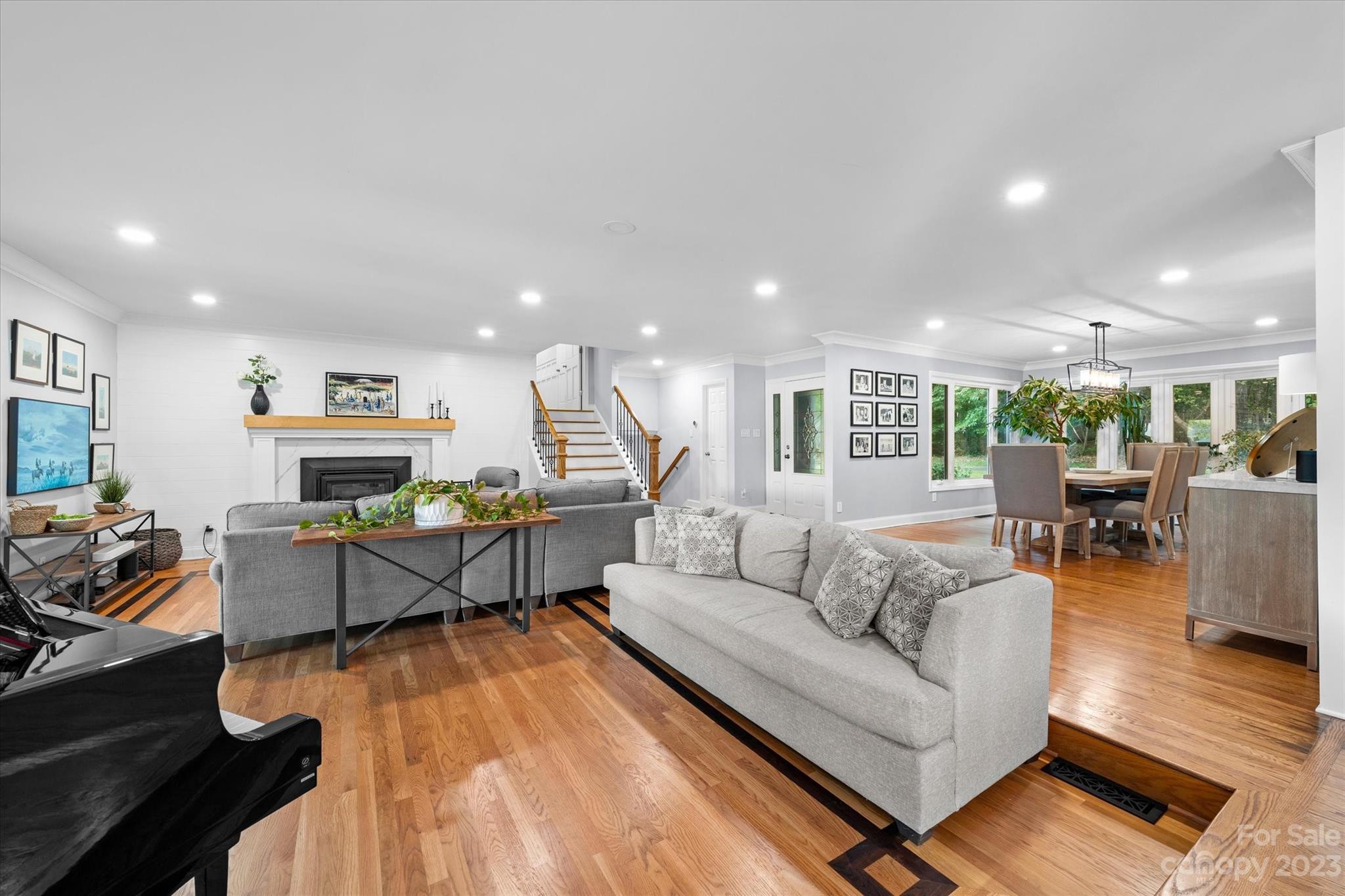 766 Eagle Road Waxhaw, NC 28173 - Photo 12 of 45 a living room with furniture and a wooden floor
