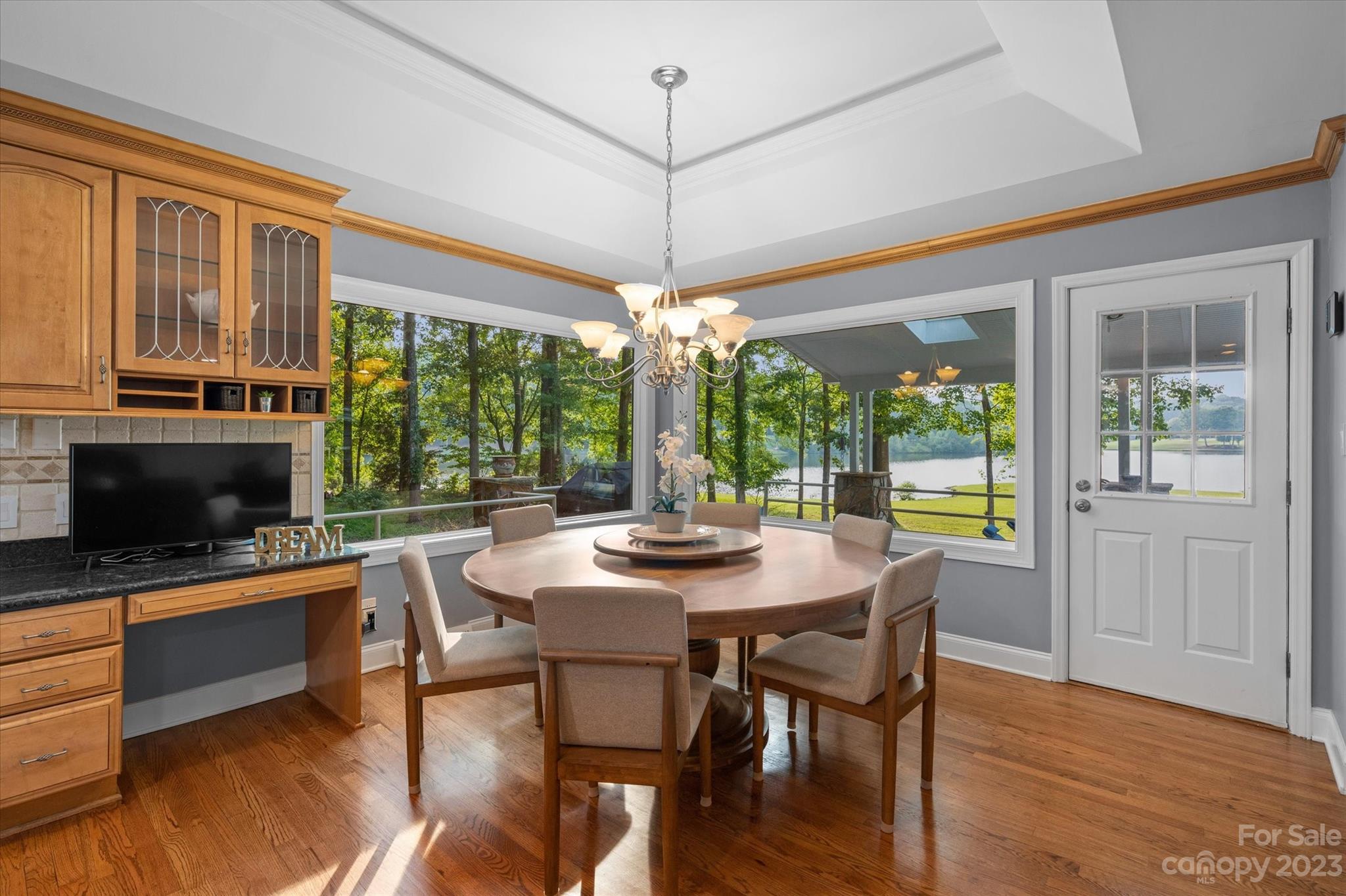 766 Eagle Road Waxhaw, NC 28173 - Photo 18 of 45 a dining room with furniture a chandelier and wooden floor