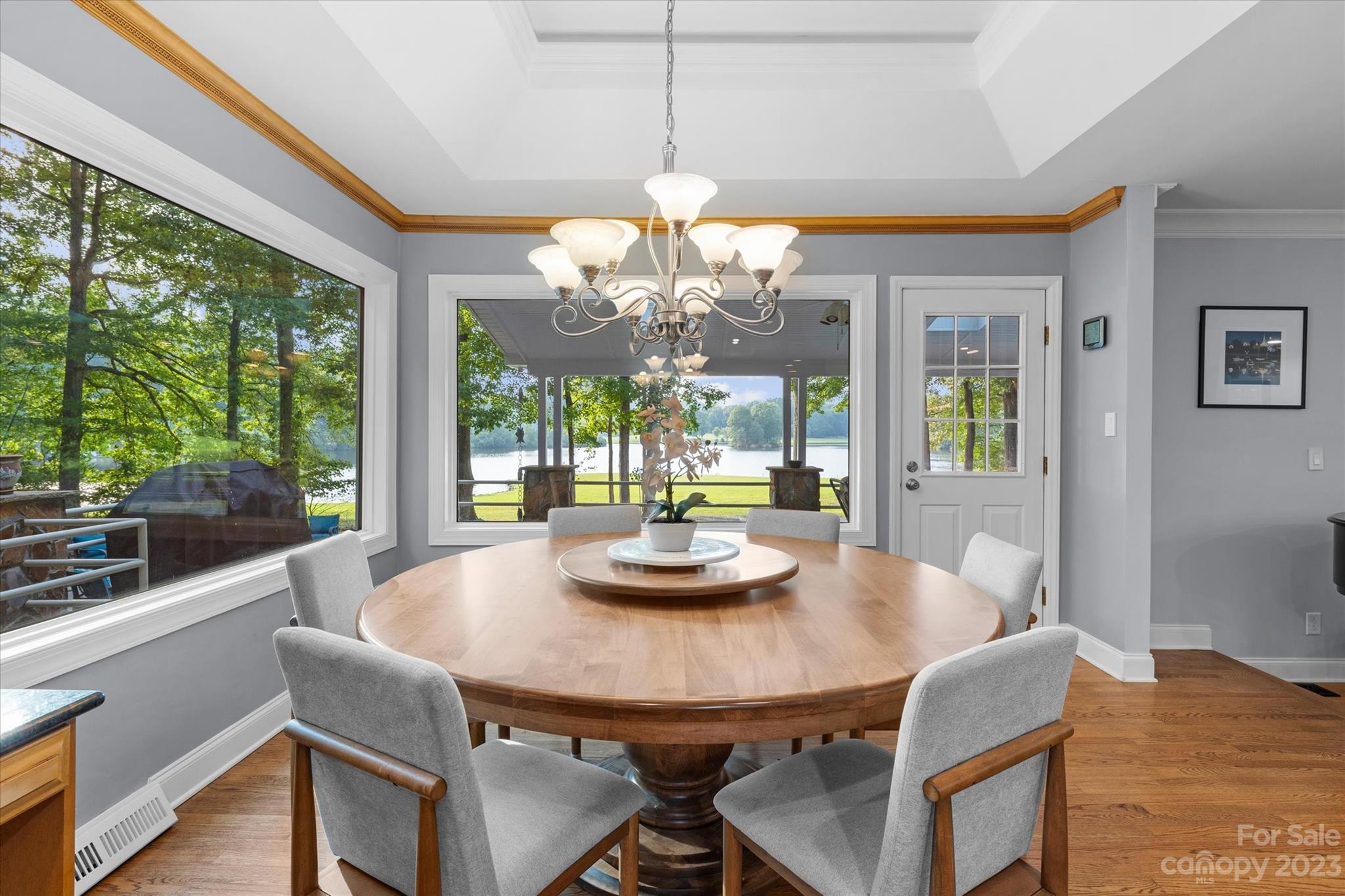 766 Eagle Road Waxhaw, NC 28173 - Photo 19 of 45 a view of a dining room with furniture wooden floor and chandelier
