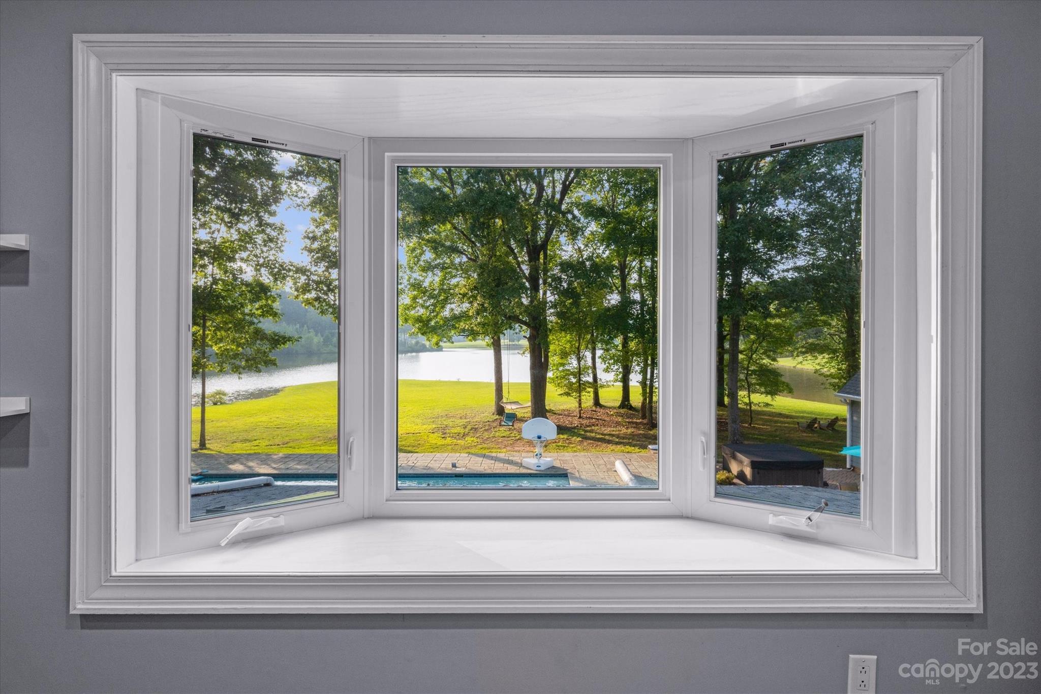 766 Eagle Road Waxhaw, NC 28173 - Photo 23 of 45 a view of a glass door with a from a porch