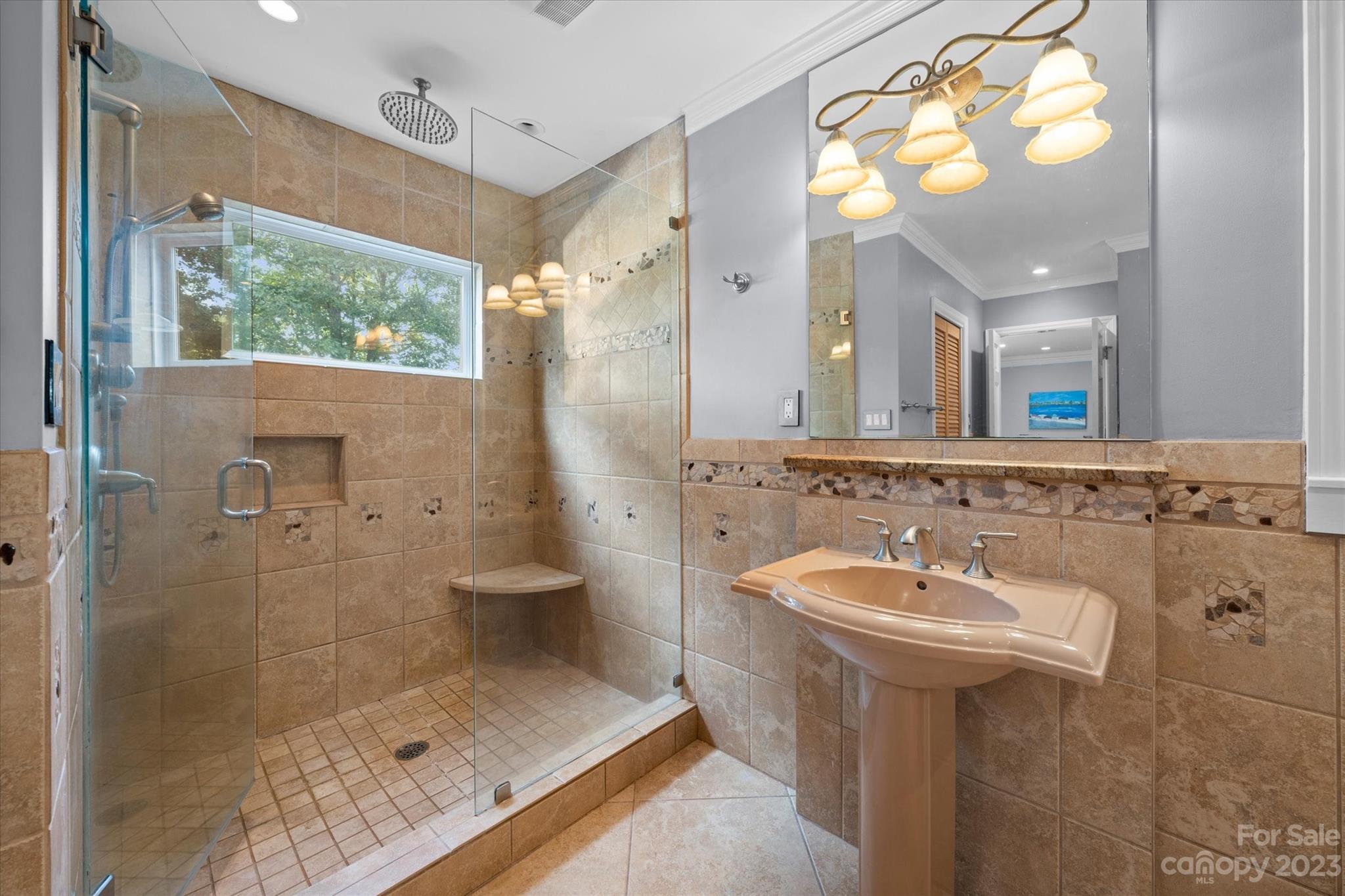 766 Eagle Road Waxhaw, NC 28173 - Photo 25 of 45 a bathroom with a sink mirror and shower