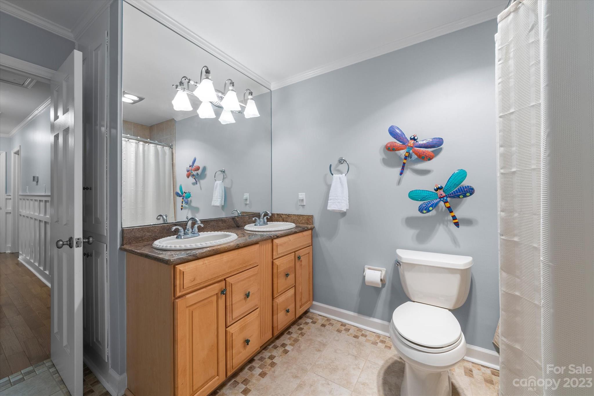 766 Eagle Road Waxhaw, NC 28173 - Photo 28 of 45 a bathroom with a toilet sink and mirror