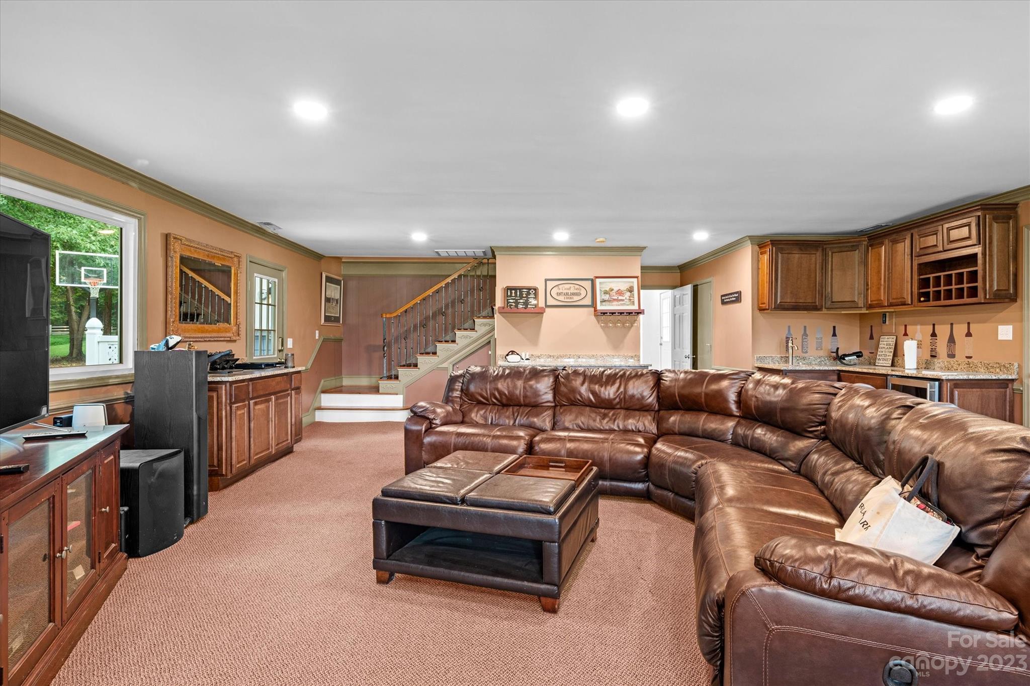 766 Eagle Road Waxhaw, NC 28173 - Photo 36 of 45 a living room with furniture and a flat screen tv