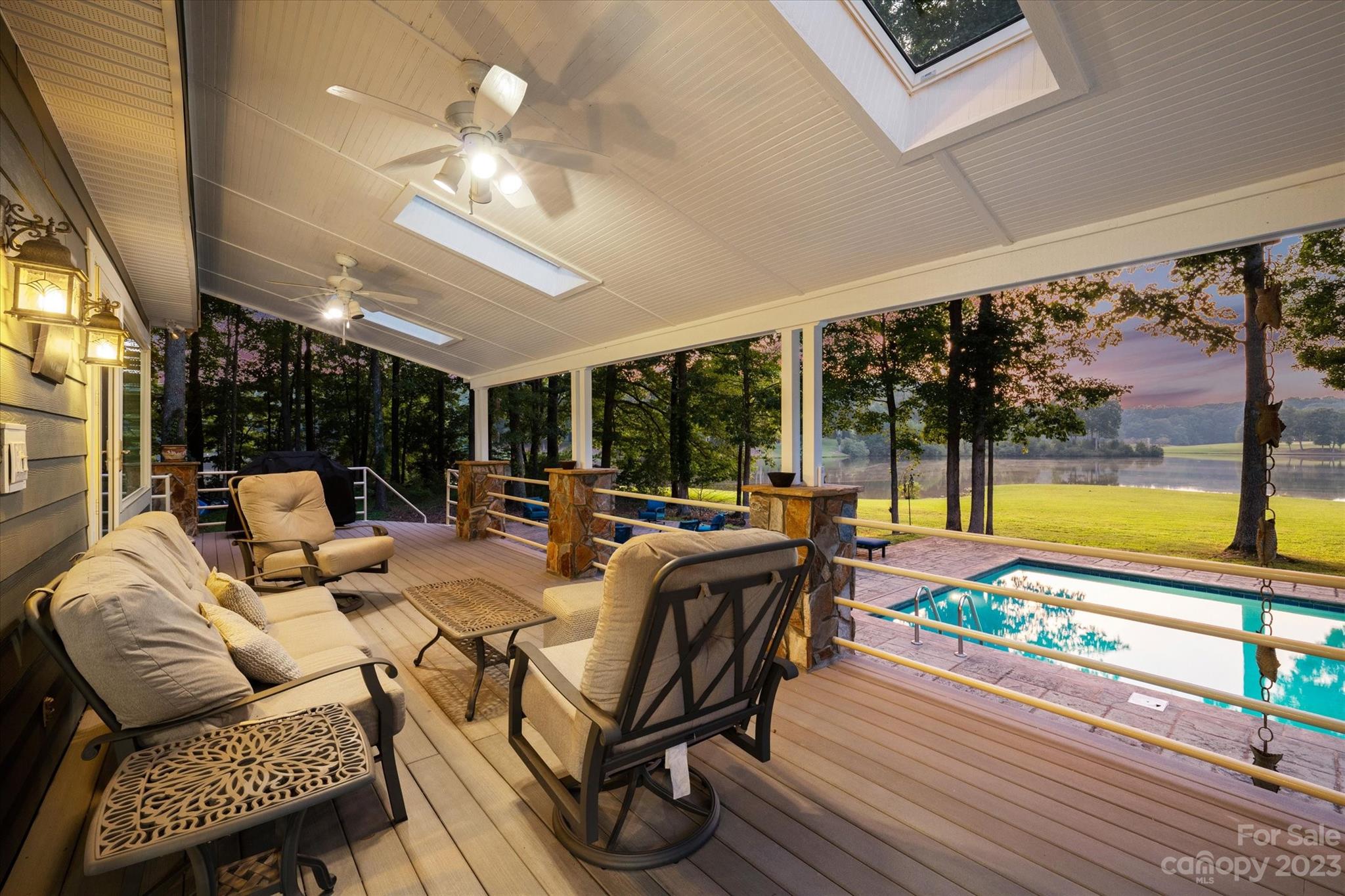 766 Eagle Road Waxhaw, NC 28173 - Photo 40 of 45 a living room with furniture and a floor to ceiling window