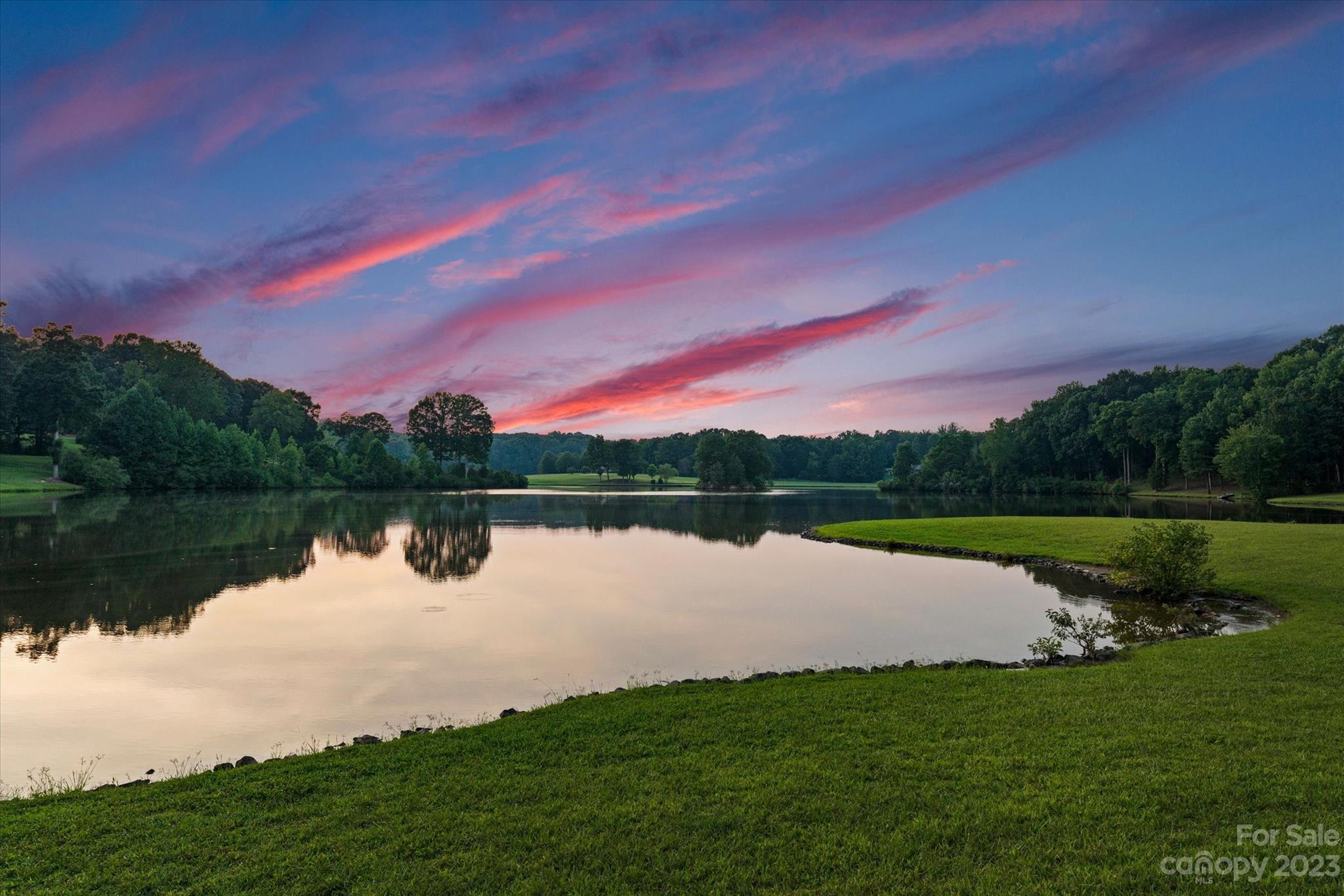 766 Eagle Road Waxhaw, NC 28173 - Photo 4 of 45 a view of a lake from a yard