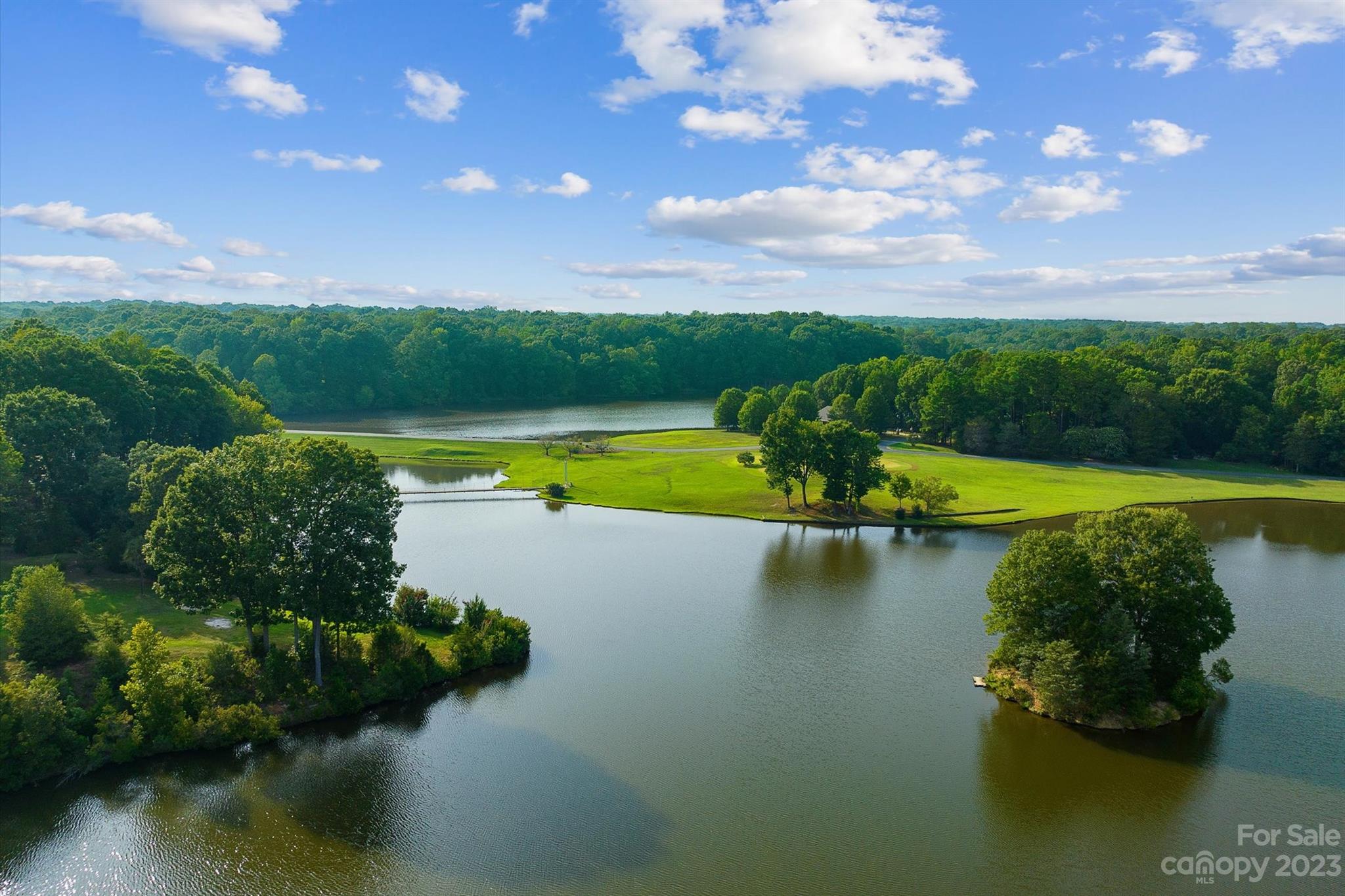 766 Eagle Road Waxhaw, NC 28173 - Photo 42 of 45 a view of a lake view with a garden