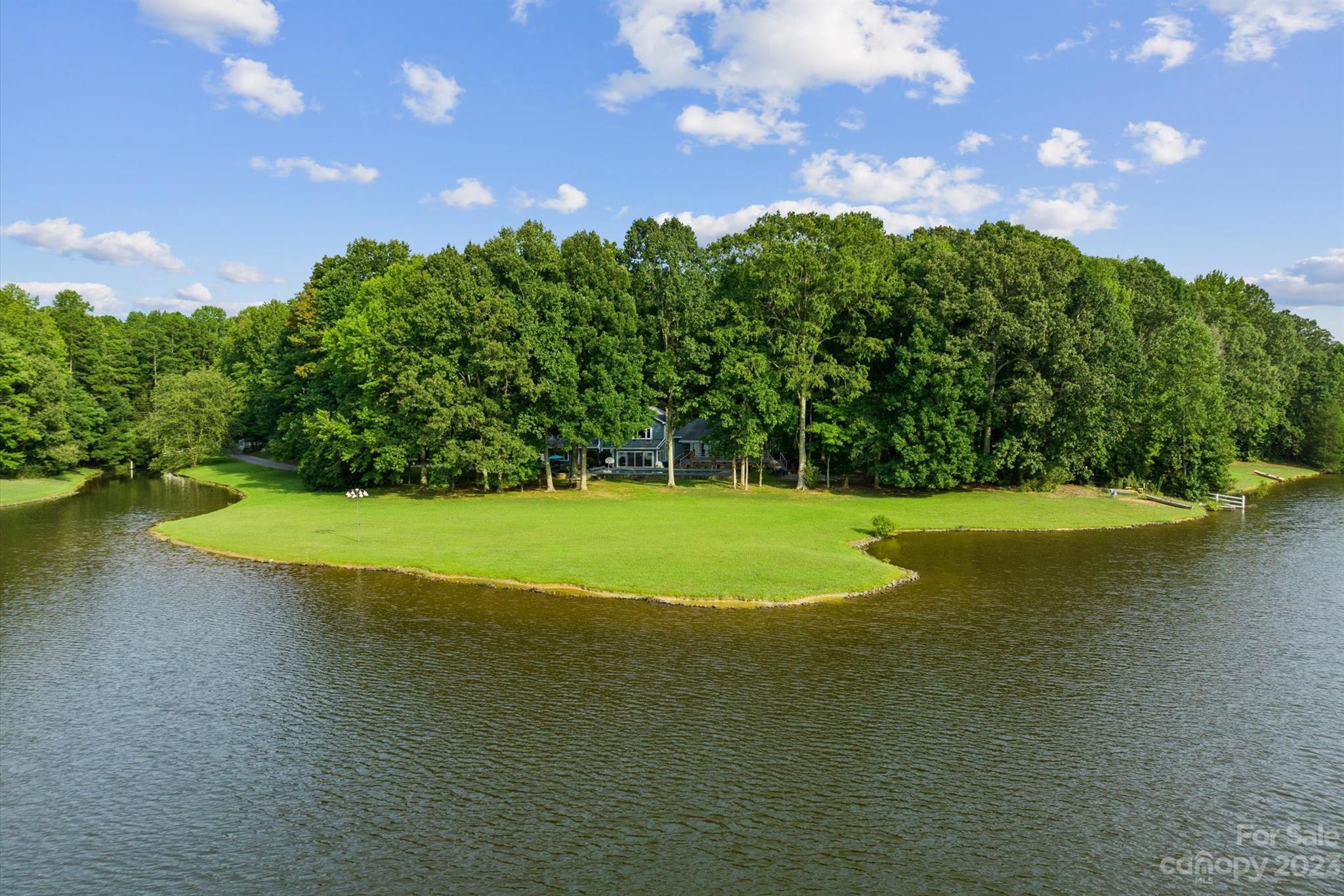 766 Eagle Road Waxhaw, NC 28173 - Photo 44 of 45 a view of a golf course with a lake