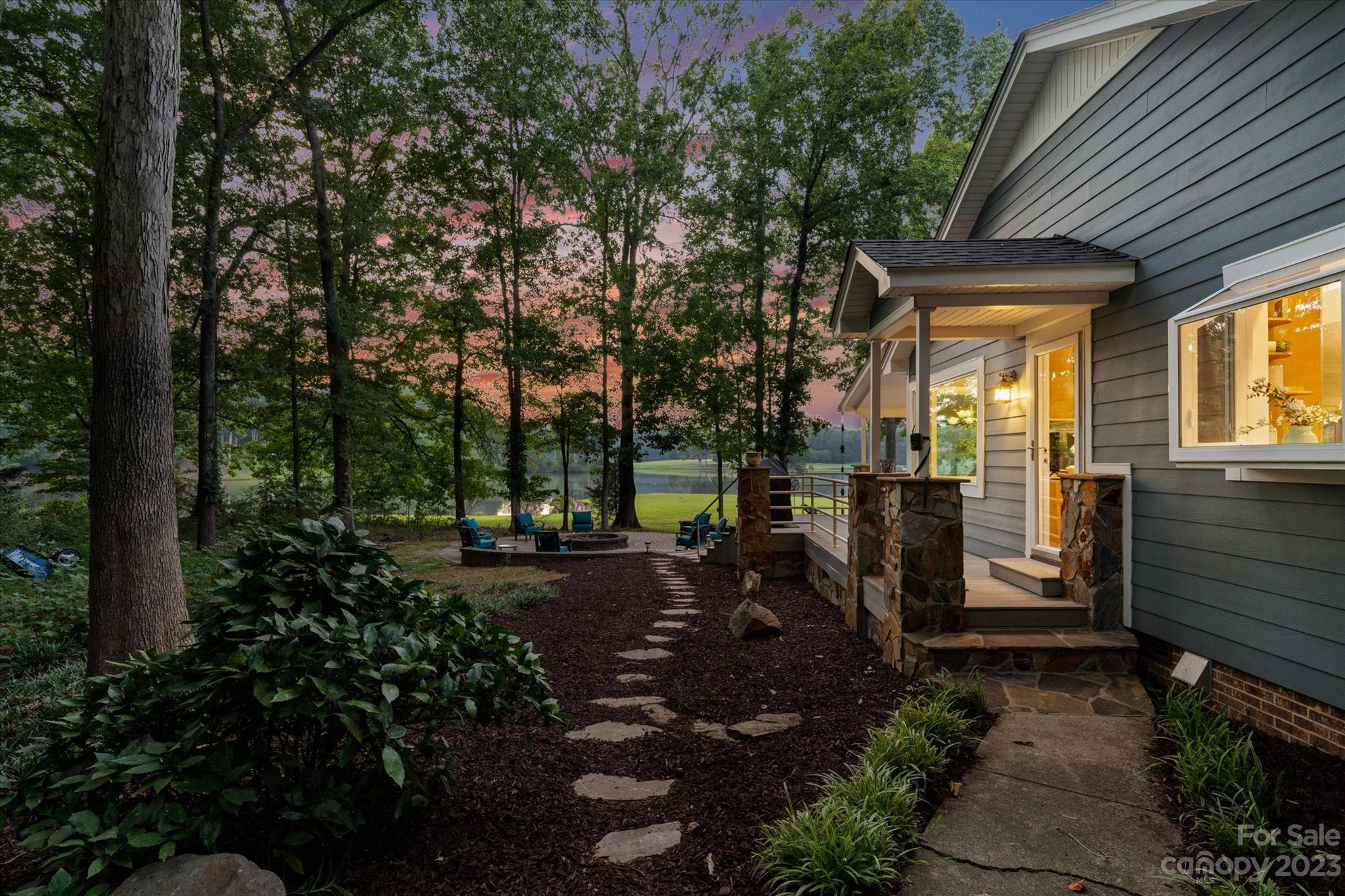 766 Eagle Road Waxhaw, NC 28173 - Photo 7 of 45 a view of a porch with furniture and garden
