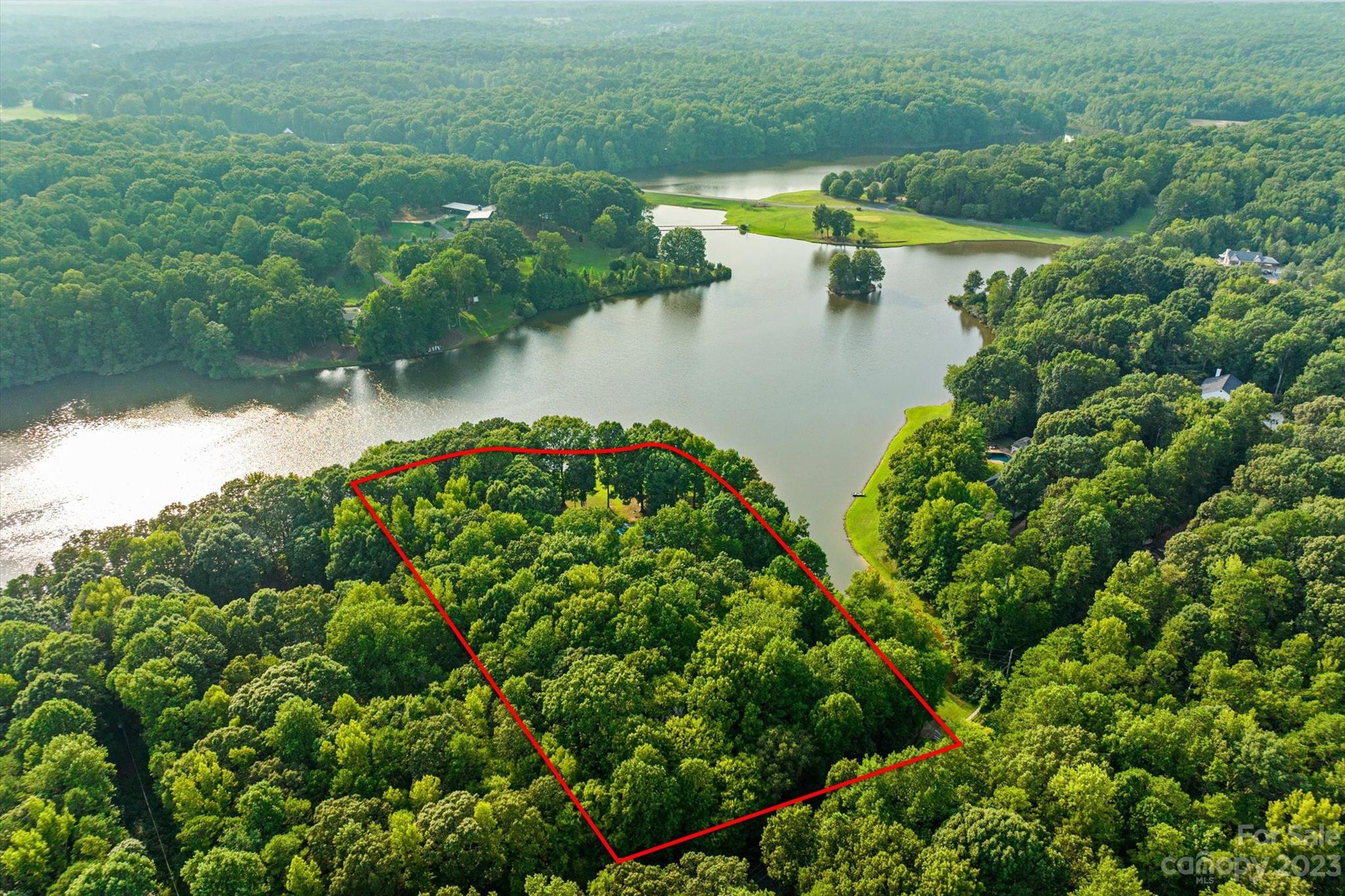 766 Eagle Road Waxhaw, NC 28173 - Photo 9 of 45 a view of a lake with a house