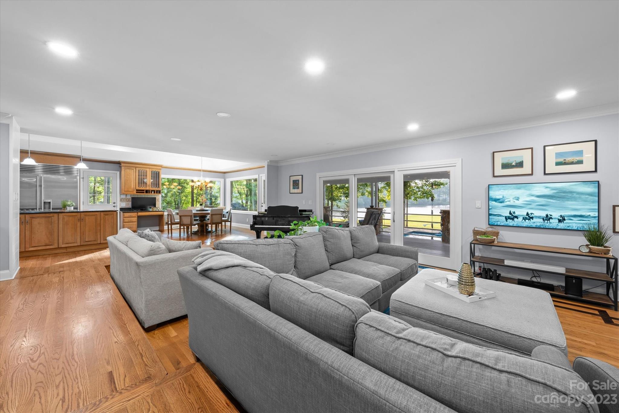 766 Eagle Road Waxhaw, NC 28173 - Photo 10 of 45 a living room with furniture and a flat screen tv