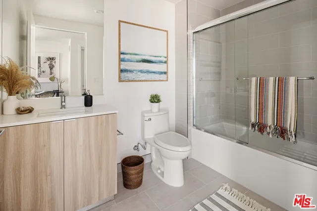 a bathroom with a toilet a sink and a bathtub