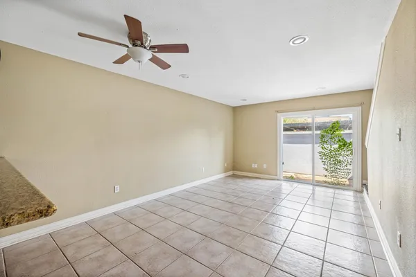 a view of a livingroom with a hardwood floor and a window
