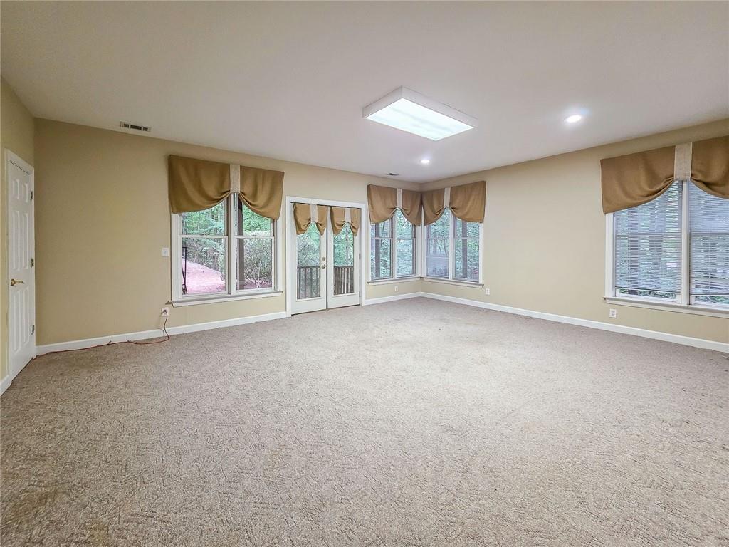 3712 Frederica Road Northwest Berkeley Lake, GA 30096 - Photo 36 of 49 an empty room with windows and view