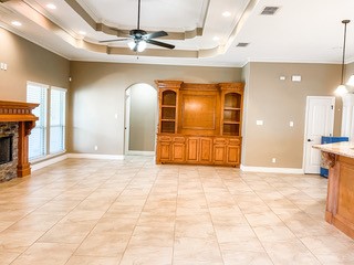 1306 Keenland Road Corpus Christi, TX 78418 - Photo 21 of 26 a view of a livingroom with a fireplace and a chandelier