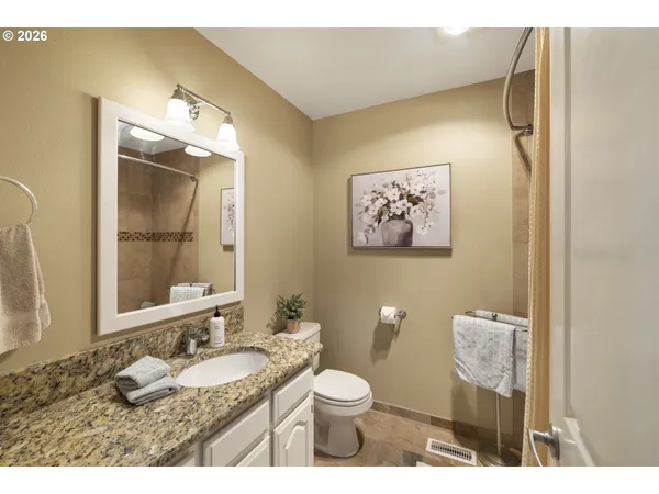 a kitchen with a sink a counter top space and appliances