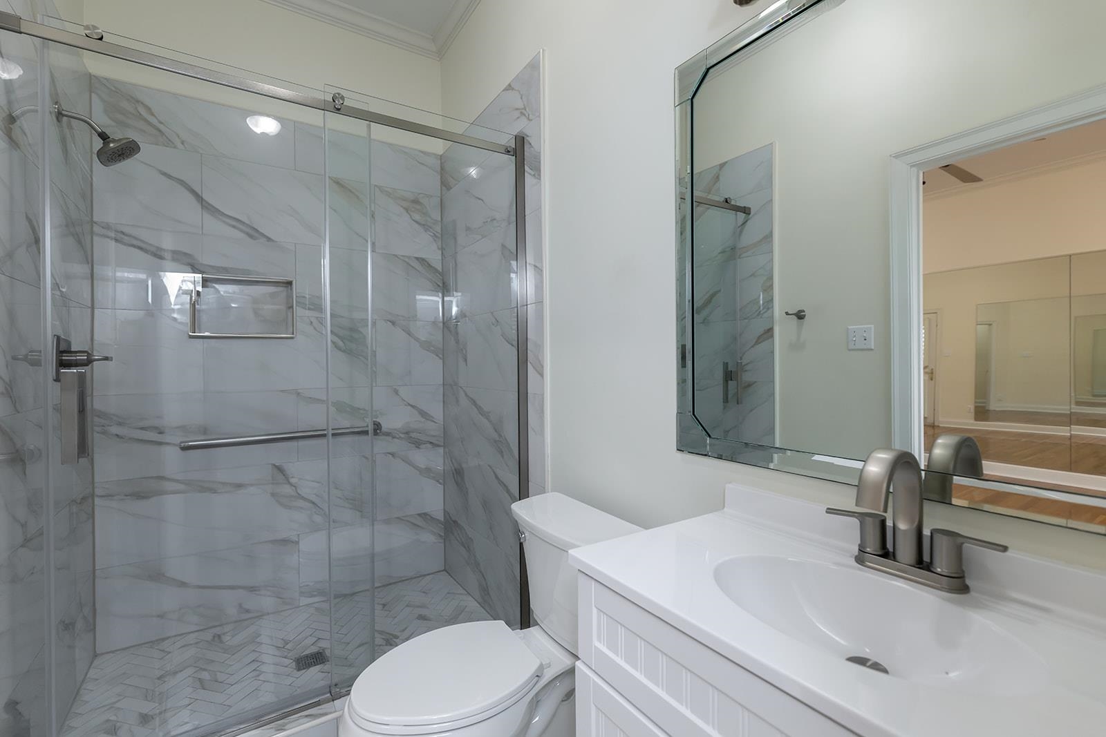 9390 Mayfield Road South Collierville, TN 38017 - Photo 20 of 40 Bathroom with vanity, a marble finish shower, and ornamental molding
