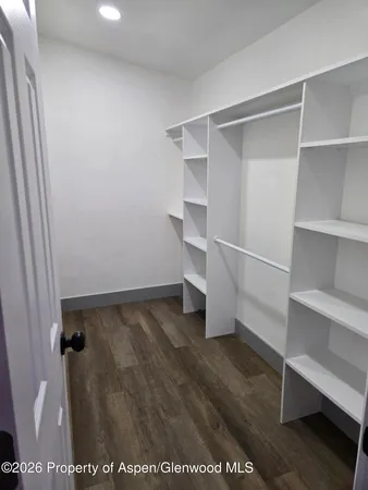 a view of an empty walk in closet