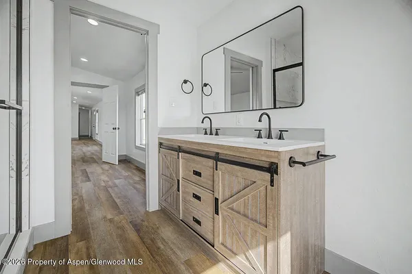 a bathroom with a sink and a mirror