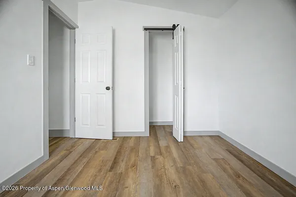 a view of wooden floor in an empty room