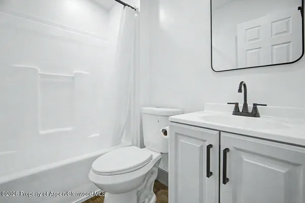 a bathroom with a sink toilet and vanity