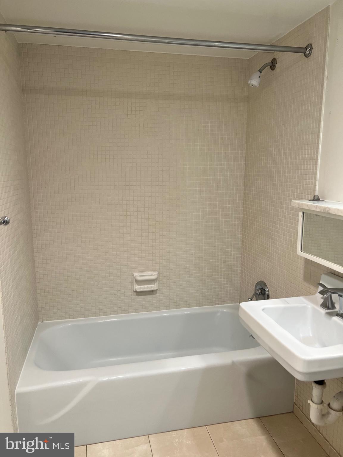 429 N Street Southwest, Unit S301 Washington, DC 20024 - Photo 16 of 19 a white bath tub and a sink
