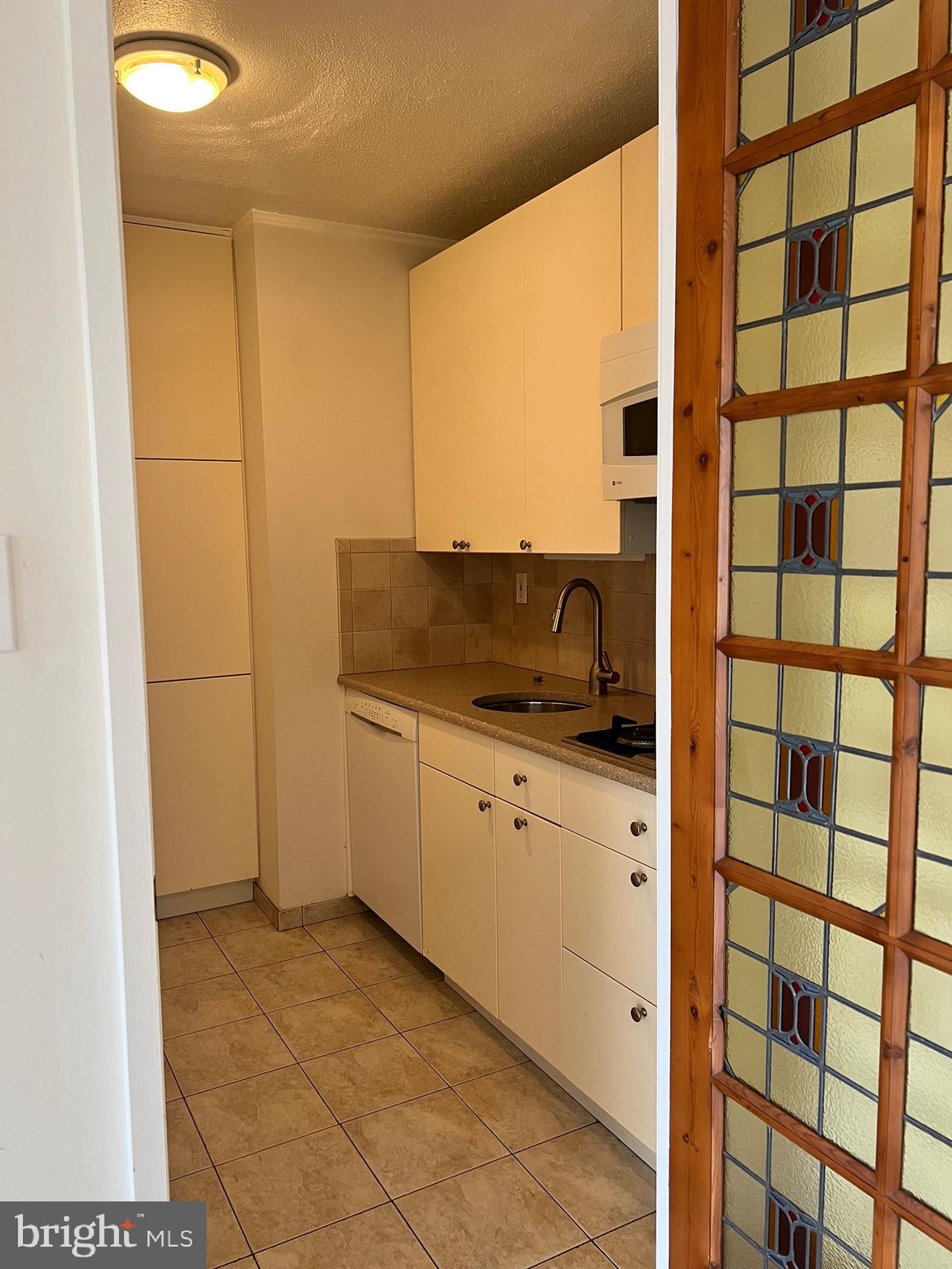 429 N Street Southwest, Unit S301 Washington, DC 20024 - Photo 4 of 19 a kitchen with a sink and cabinets
