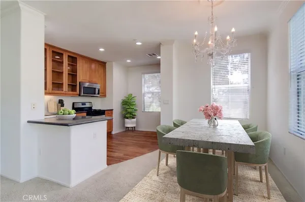 a kitchen with sink cabinets and dining table