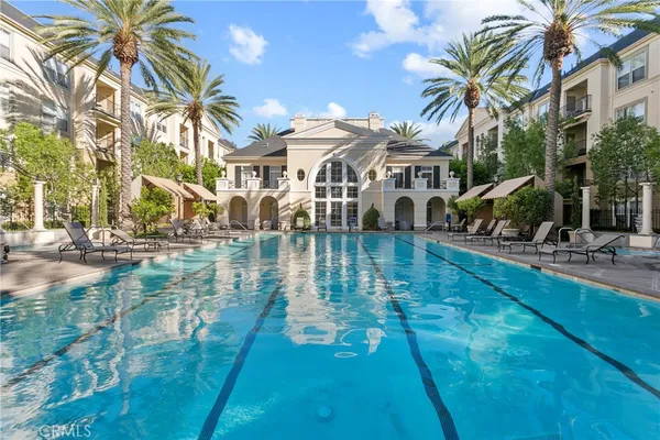 a swimming pool with outdoor seating and yard